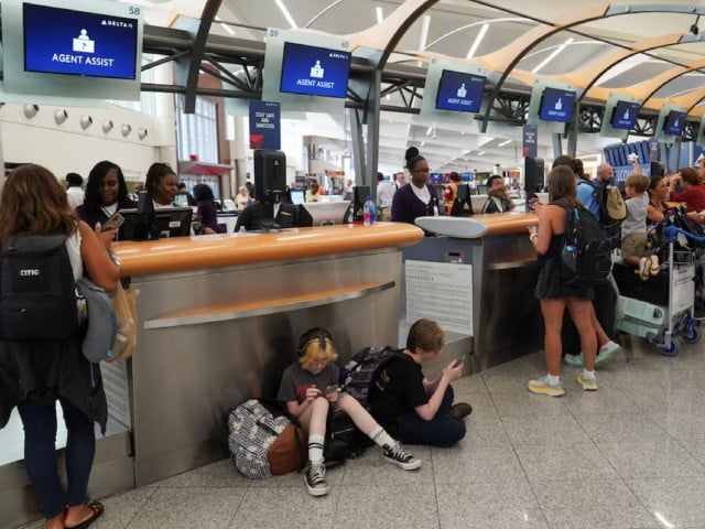 people speak to delta agents as they try to rebook their travel plans after long delays following cyber outages affecting airlines at hartsfield jackson atlanta international airport in atlanta georgia us july 22 2024 photo reuters